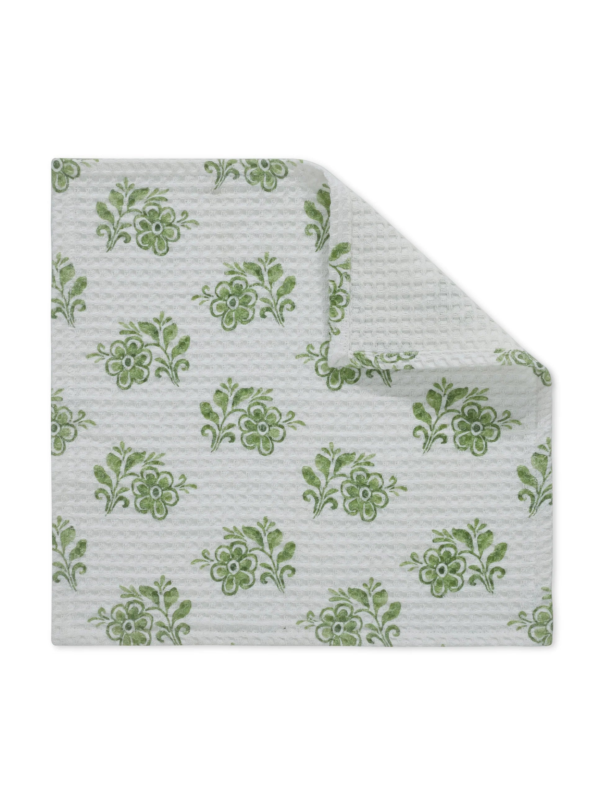 Floral patterned fabric with green flowers on a white background