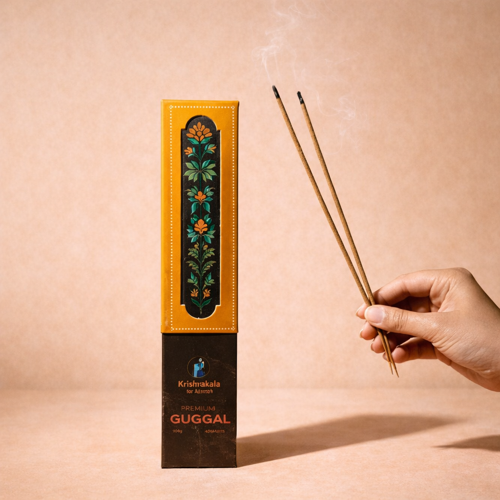 Guggal incense stick box and a hand holding incense sticks on a beige background