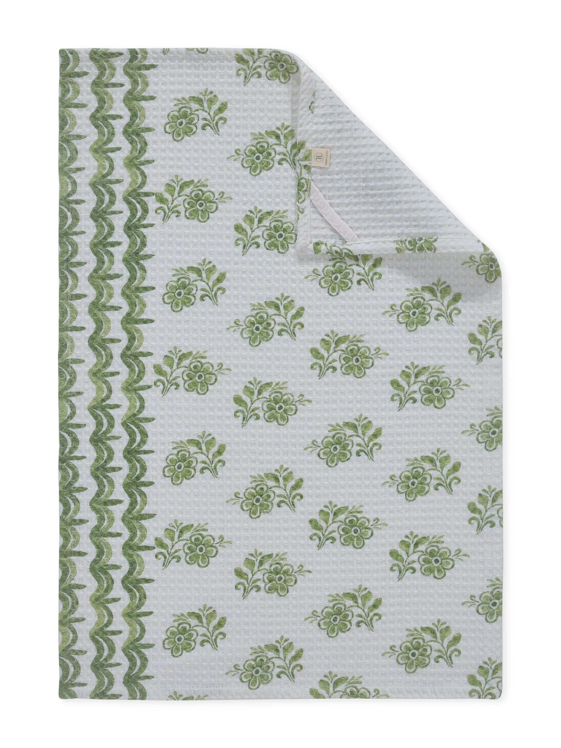 Green floral patterned fabric on a white background