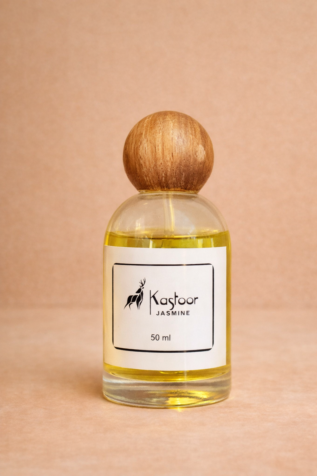 Perfume bottle with wooden cap on a beige background