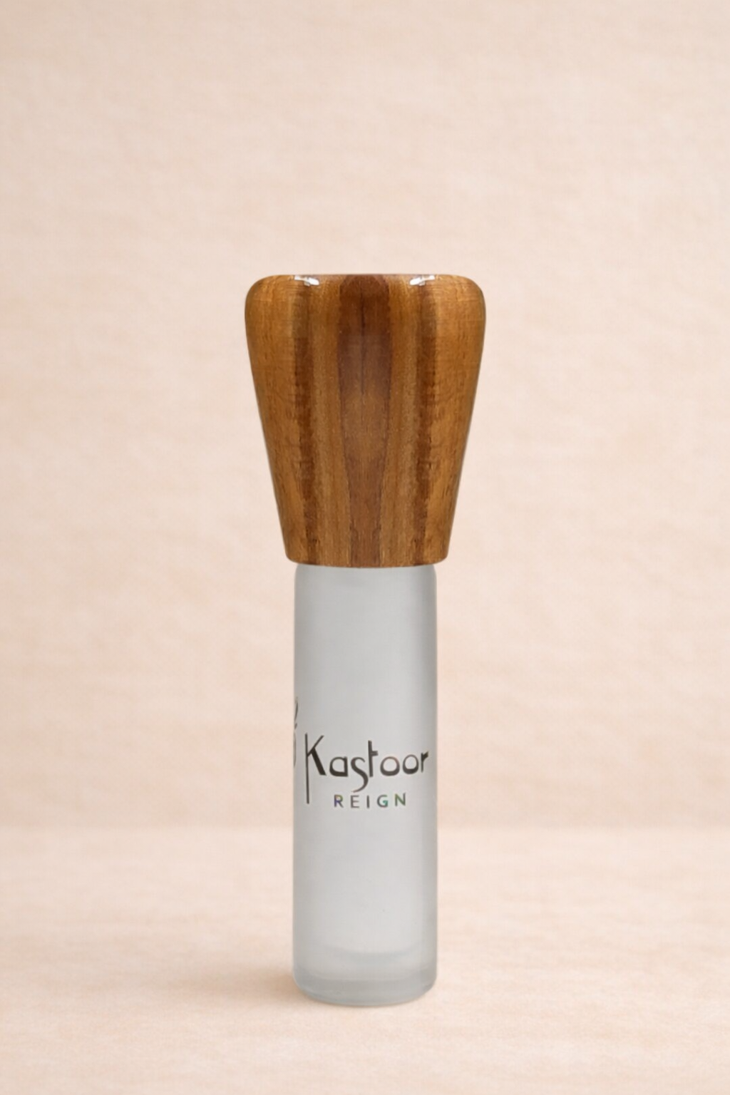 Fragrance Bottle with wooden cap on a beige background. Reign fragrance 